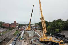 October 2020 - Using tandem cranes, crews place a deck beam for the new bridge over Stony Creek.