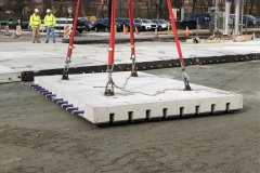 December 2022 - Workers install pre-cast concrete slabs at the intersection of Main and Markley.