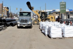 March 2020 - Workers unload piping to be used to divert Stony Creek during northbound bridge demolition.