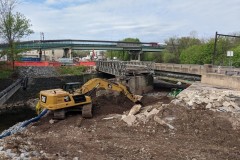 April 2020 - Following removal of a section of the old bridge, an excavation crew removes the old northern abutment.